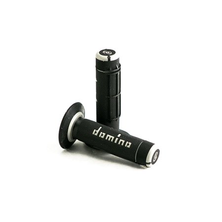 Black rubber grips with a full diamond texture, featuring silver end caps and the "Domino" logo in white, designed for enhanced grip and control.