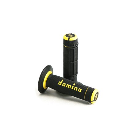 Black rubber grips with yellow accents, featuring a full diamond texture and the "Domino" logo, designed for enhanced grip and comfort.