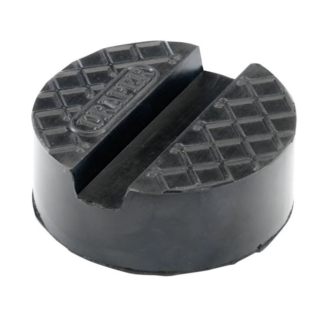 Large round rubber pad for a trolley jack, featuring a textured surface for grip and a central groove, marked with the Draper logo.