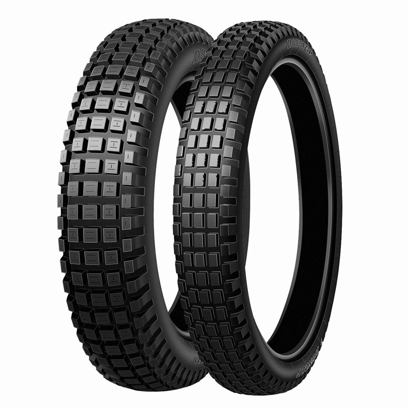 Dunlop D803 GP rear motorcycle tire, 120/100 R18 size, featuring a rugged tread pattern with square blocks for enhanced grip, finished in a sleek black rubber material.