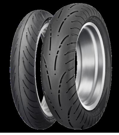 Dunlop D428 motorcycle tire in size 180/65B16, featuring a black rubber tread with a distinctive pattern and a silver metallic rim, designed for rear wheel use.