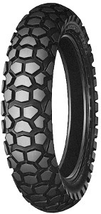 Black motorcycle tire with a hexagonal tread pattern, labeled "Dunlop K 850," size 4.60-18, designed for rear wheel use, featuring a durable rubber material.