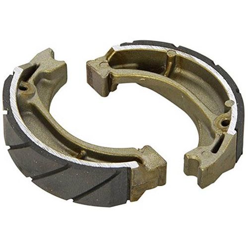 Grooved motorcycle brake shoes in a metallic gold and black color, featuring a curved design with a textured surface for improved grip and performance.