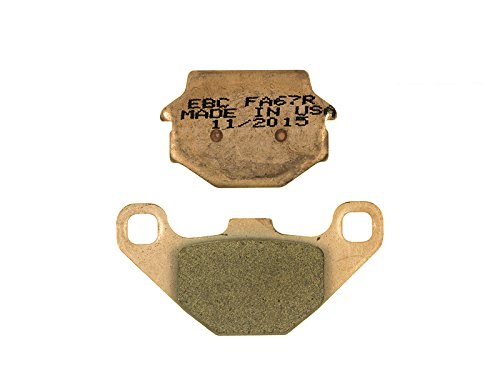 EBC Brakes FA067R brake pad set featuring a metallic backing plate with engraved text and a green friction material pad, designed for high-performance braking.