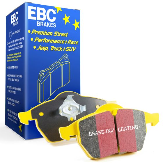 EBC Brakes Yellowstuff performance brake pads feature a yellow backing with red friction material, packaged in a blue box with yellow stars and product details.