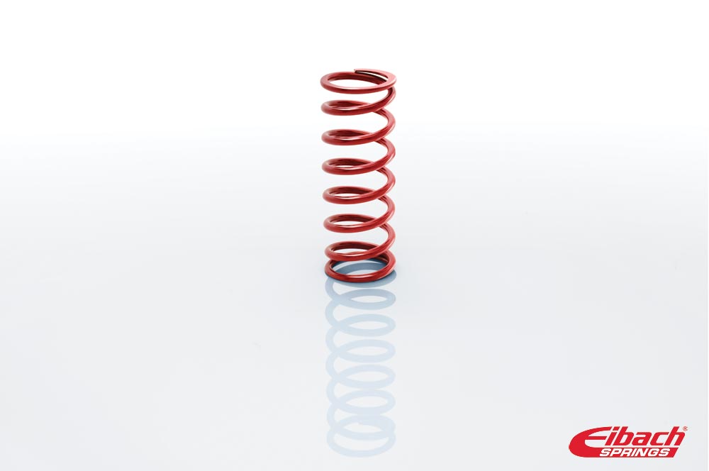 Red coil over spring by Eibach, measuring 2.25 inches in diameter and 8 inches in height, featuring a smooth, metallic finish with distinct spiral coils.