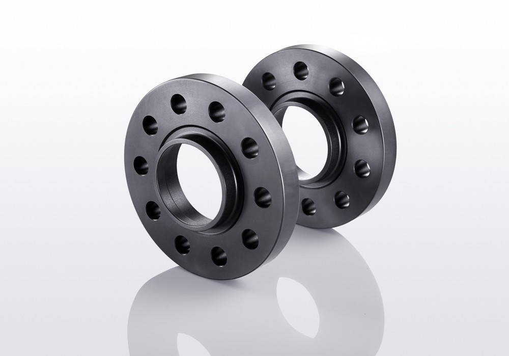 Two black aluminum track widening spacers, each 10mm thick, featuring five holes and designed to increase track width by 20mm per axle.