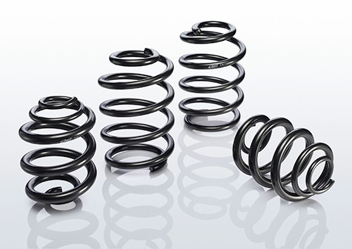Black coil springs from the EIBACH E10-20-031-18-22 Suspension Kit, showcasing a smooth finish and varying diameters for enhanced vehicle performance.