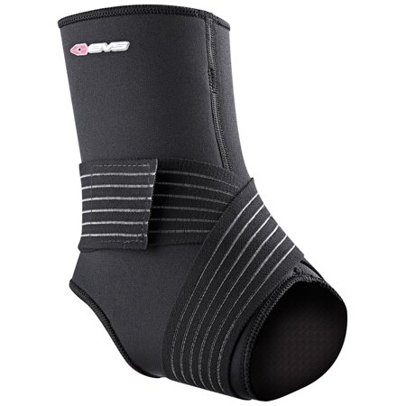 Grey ankle stabilizer made of neoprene with adjustable straps for support, featuring a cut-out toe section and the EVS logo on the side.