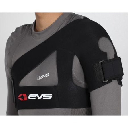 Black EVS SB02 shoulder support in size S, featuring a padded design, adjustable strap, and logo, worn over a gray long-sleeve shirt.