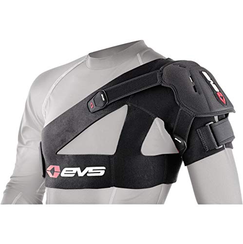 Black EVS SB04 Shoulder Stabiliser in size M, featuring adjustable straps, padded support, and a sleek design, worn over a gray long-sleeve shirt.
