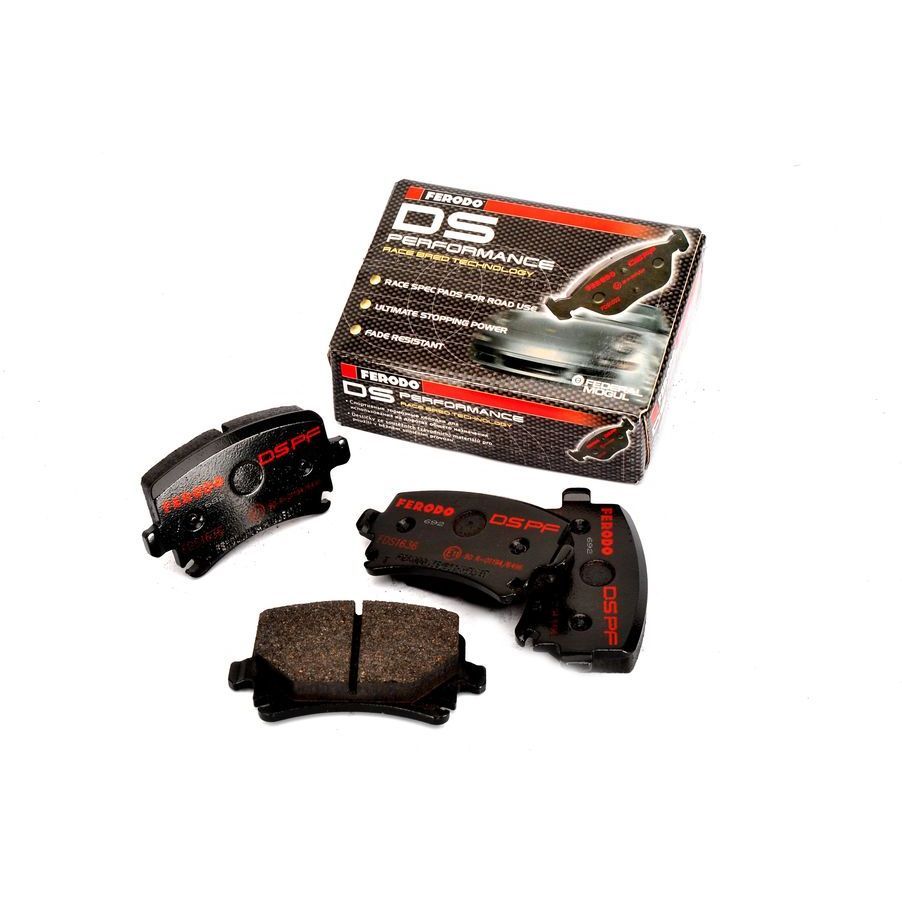 Black brake pads with red lettering labeled "DS PERFORMANCE" alongside a box featuring a sleek design and logo, indicating high-performance racing components.