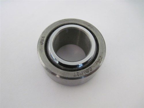Imperial PTFE lined spherical bearing with a 1/4 inch bore, featuring a shiny metallic exterior and a smooth inner surface, marked with "USA" and "COM32."