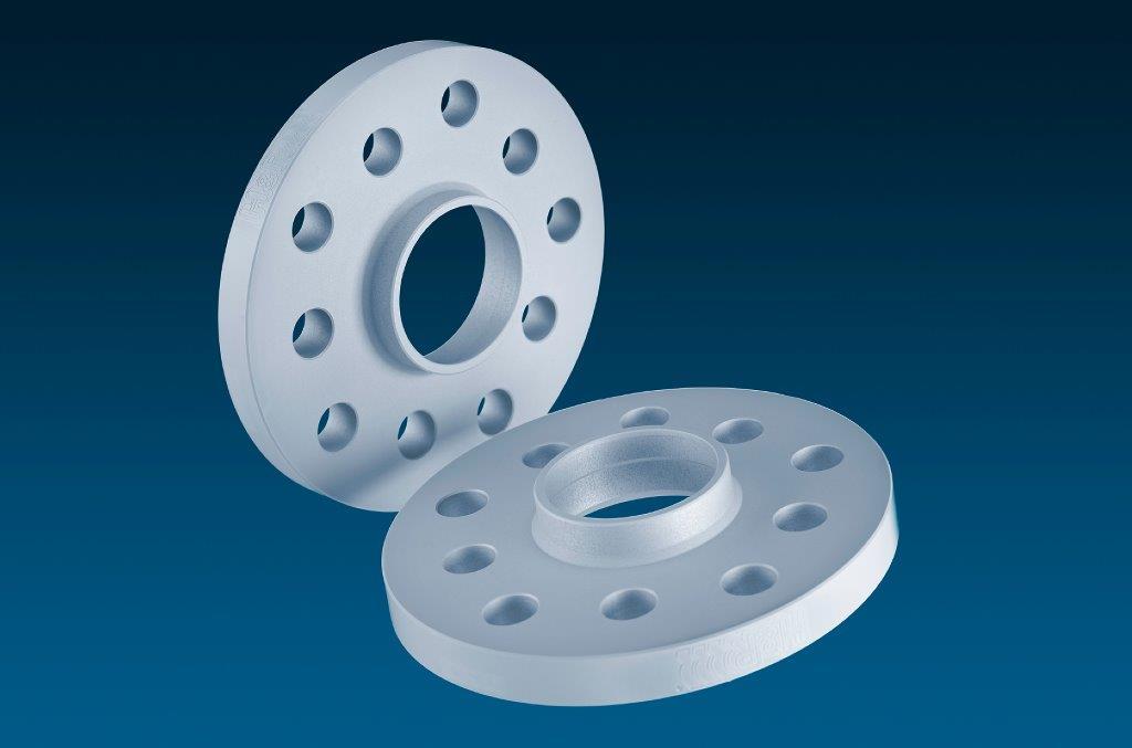Silver aluminum wheel spacers with 10mm thickness, featuring five holes for mounting, designed to widen track by 20mm per axle, showcasing a smooth, polished finish.