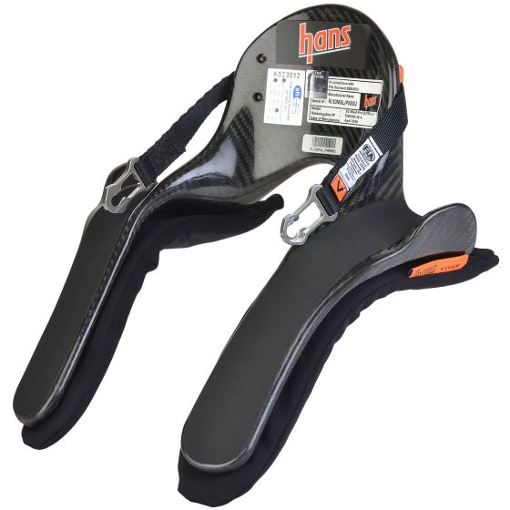 Black and gray carbon fiber HANS device with adjustable straps, featuring a medium size and a 20-degree angle, labeled with the brand "hans" and product details.