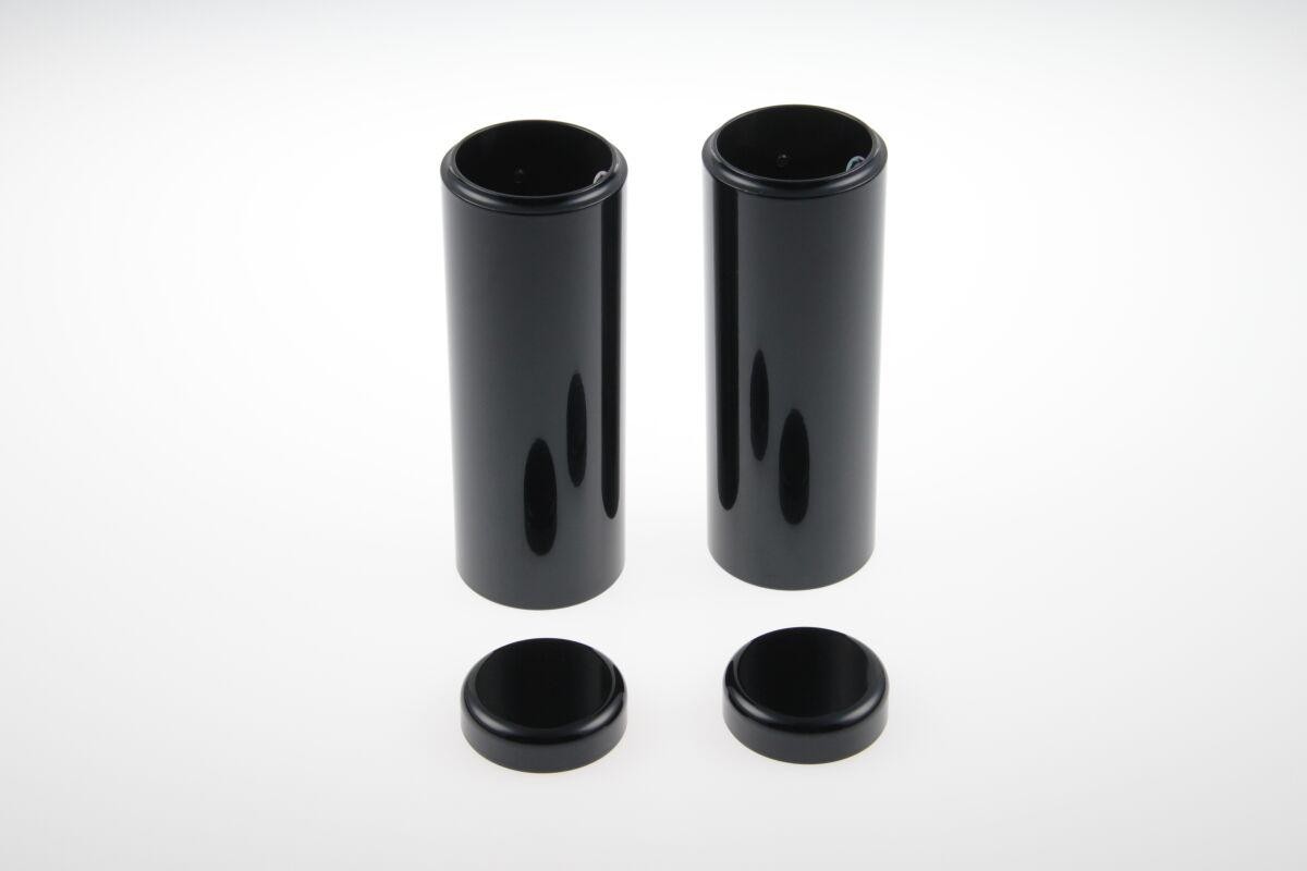 Black HD-SPO085 Cult Werk fork covers designed for Harley Davidson XL 1200 X (2016-2020), featuring a sleek, glossy finish and two cylindrical pieces with matching caps.