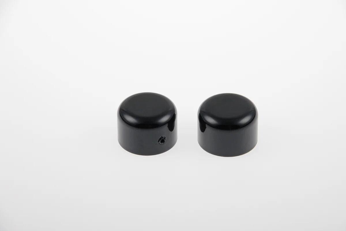 Black HD-UNI034 Cult Werk axle cover set for Harley Davidson VRSCA 1130 (2002-2006), featuring a smooth, glossy finish and rounded design.