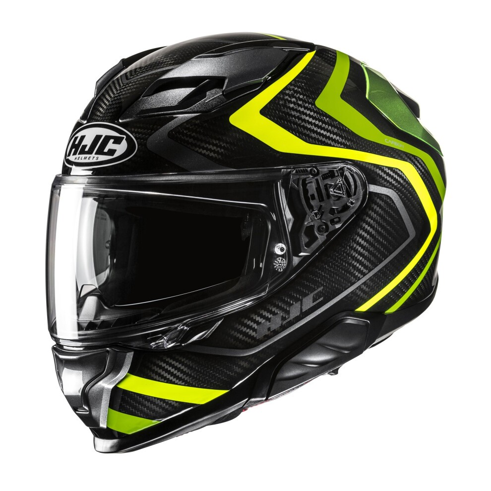 Black carbon fiber full face helmet with vibrant yellow accents, featuring a clear visor, aerodynamic design, and HJC branding on the front.