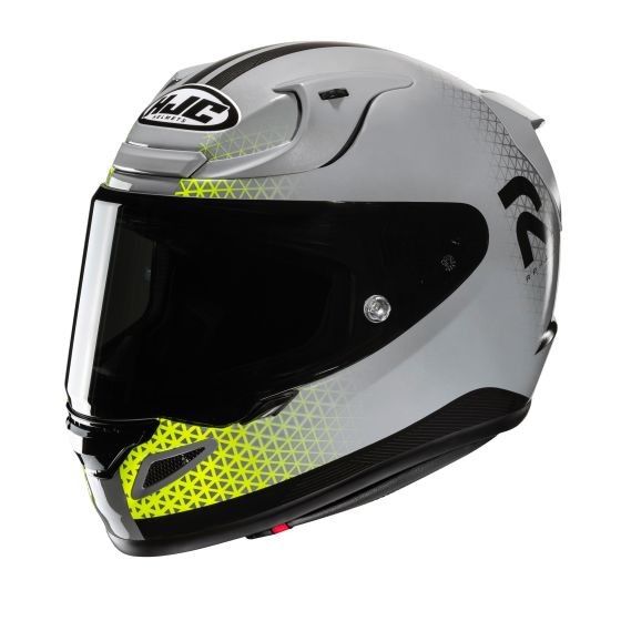 Full face motorcycle helmet in glossy silver with yellow geometric accents, featuring a dark visor, aerodynamic shape, and ventilation ports for enhanced airflow.