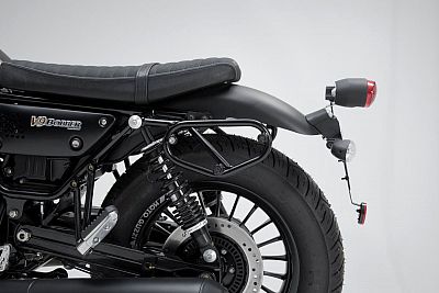 Black metal SW-Motech SLC side carrier mounted on a Moto Guzzi V9 Roamer/Bobber, featuring a sturdy design, integrated mounting points, and a sleek finish, positioned near the rear tire.