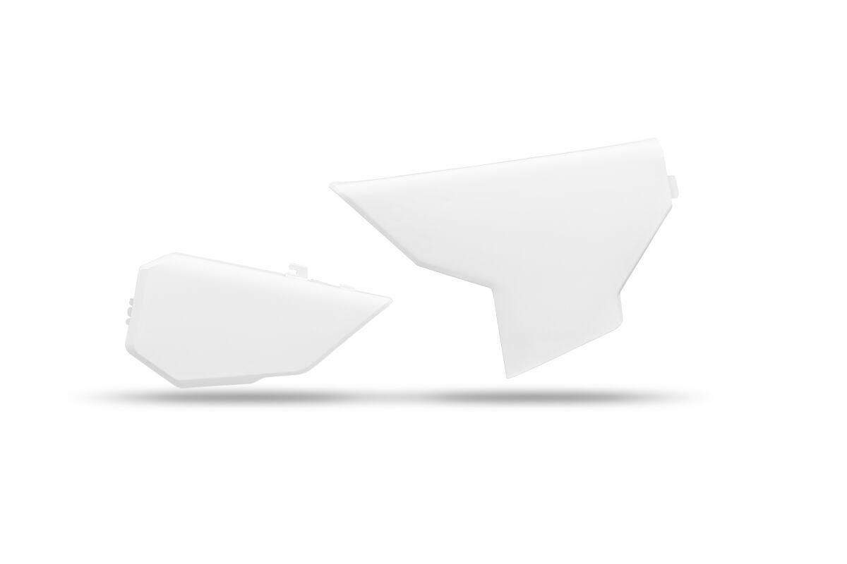White UFO air box covers designed for Husqvarna FC250 models from 2023-2024, featuring a sleek design with angular shapes and a smooth plastic finish.