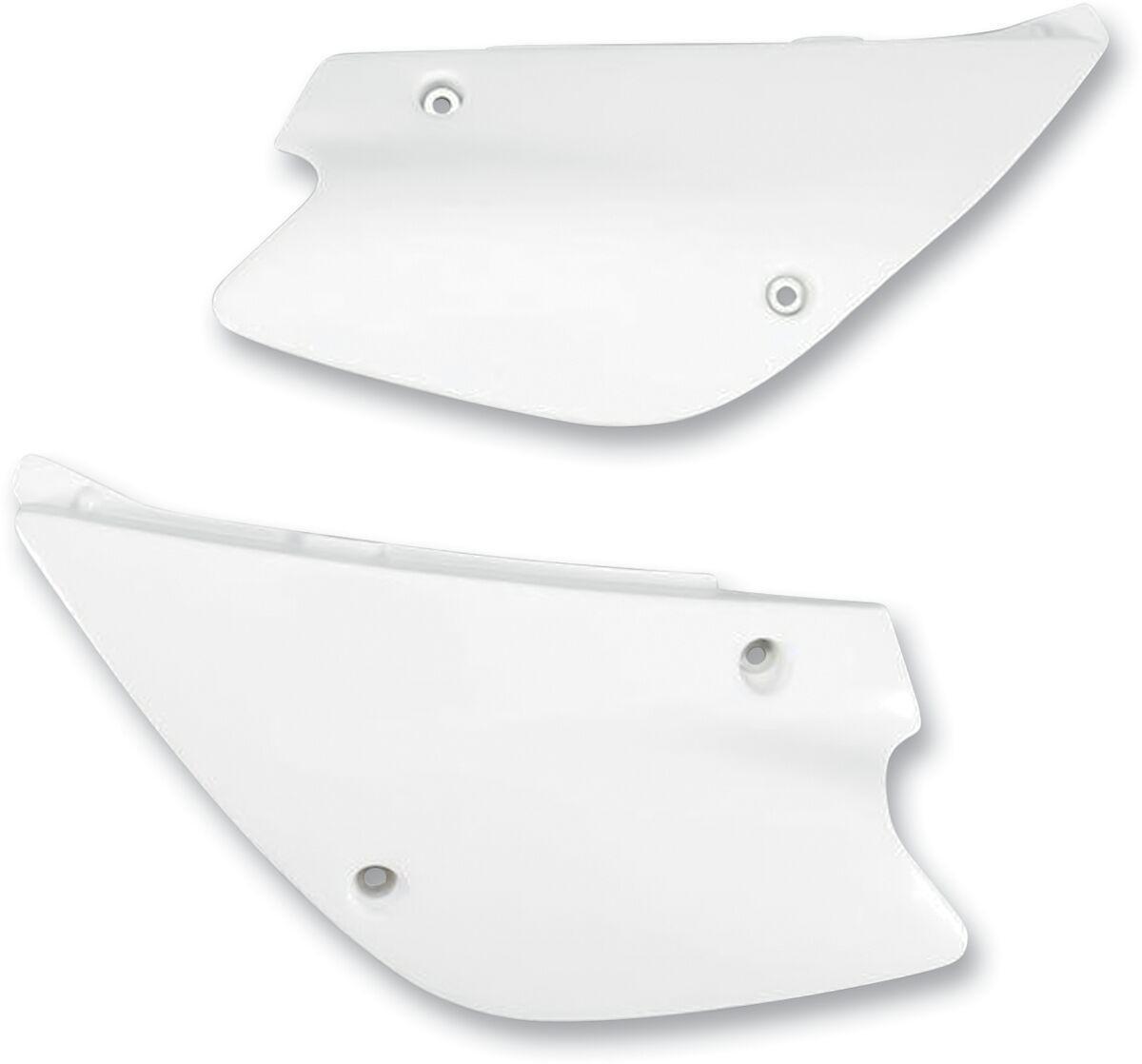 White plastic side panels designed for Kawasaki KX 85 models from 2001 to 2006, featuring smooth surfaces and pre-drilled holes for easy installation.