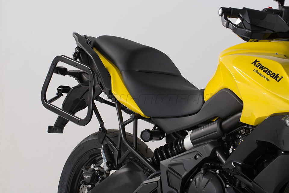 Black SW-Motech EVO Side Carriers designed for Kawasaki Versys 650 (2014 and later), featuring a sturdy metal construction and a sleek, minimalist design for easy luggage attachment.
