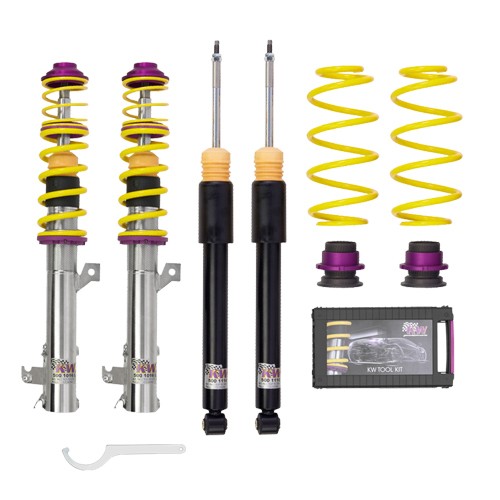 KW Suspension V1 Coilover Kit featuring silver metal shock bodies, yellow and purple springs, black dampers, and a tool kit for installation, designed to lower vehicle height.