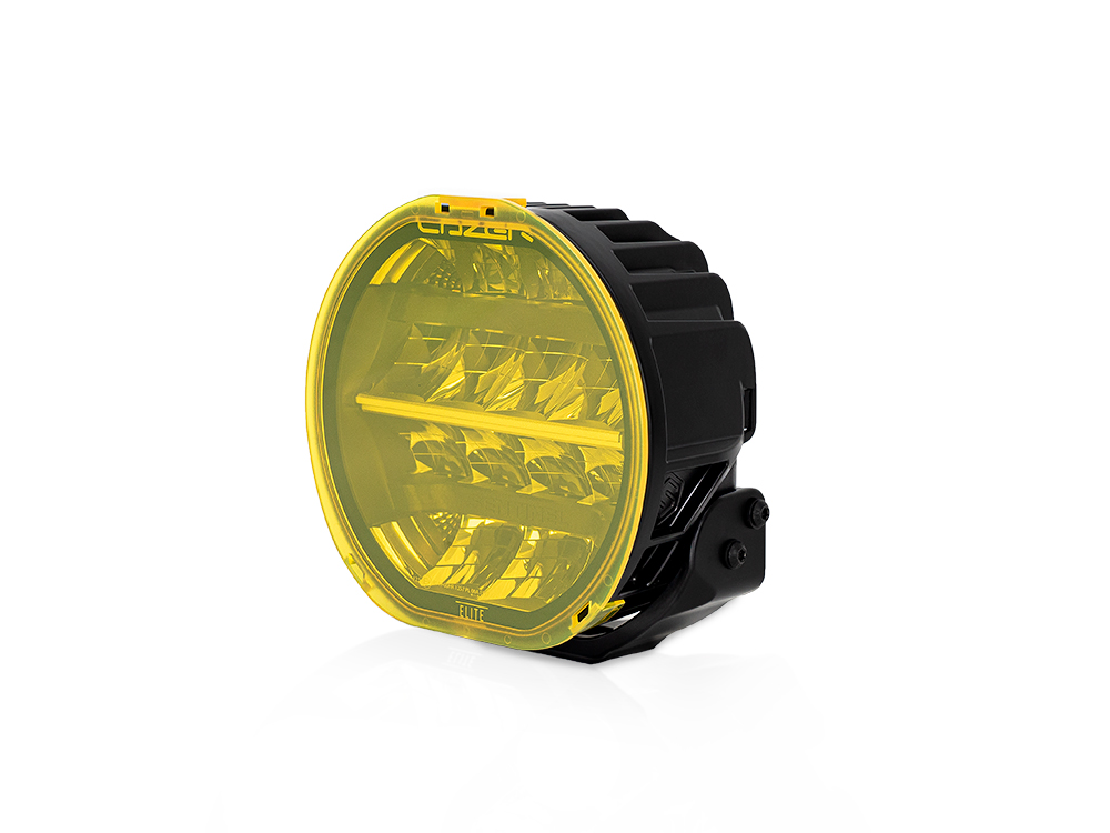 Round amber lens cover for Lazer Lamps Sentinel, featuring a durable black housing and a secure mounting bracket, designed for enhanced visibility and protection.