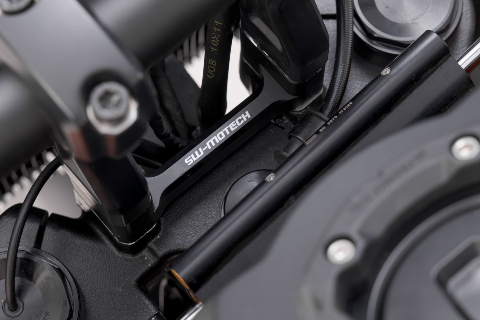 Black SW-Motech bar riser with a height of 50 mm, designed for H-D Pan America 1250, featuring a sturdy metal construction and engraved branding.