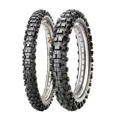 Maxxis M7305 57M Intermediate 2PL Pro E Marked Rear Tyre in size 100/90-19, featuring a rugged black rubber tread with deep grooves for traction and a silver rim.