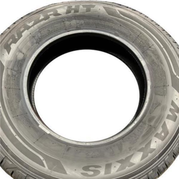 Black Maxxis HT-780 RAZR HT tire with a size of 275/60R20 and a load index of 115H, featuring a rugged tread pattern designed for durability and performance.