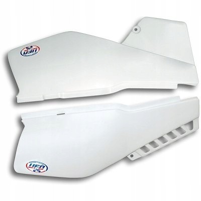 White vintage side panels for Yamaha XT600 (1987-90) by UFO, featuring a sleek design and vented sections, with a logo sticker on each panel.