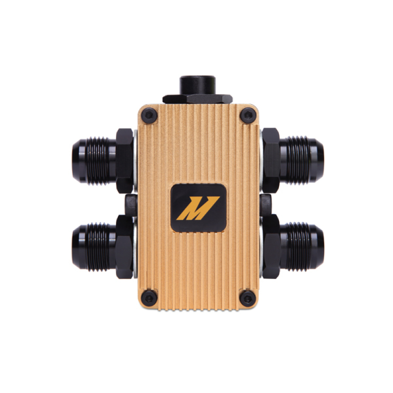 Mishimoto In-Line Oil Thermostat features a gold aluminum body with black fittings and a prominent black logo on the front, designed for efficient oil temperature regulation.