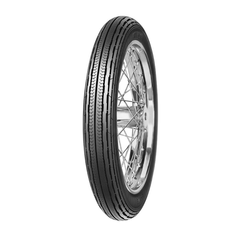 Black Mitas H-04 motorcycle tyre, size 3.25 18 (59P) TT, featuring a tread pattern designed for enhanced grip, mounted on a silver wire-spoke rim.