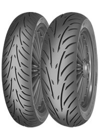 Black motorcycle tires with a distinctive tread pattern, featuring deep grooves for enhanced grip and stability, designed for touring applications by MITAS.