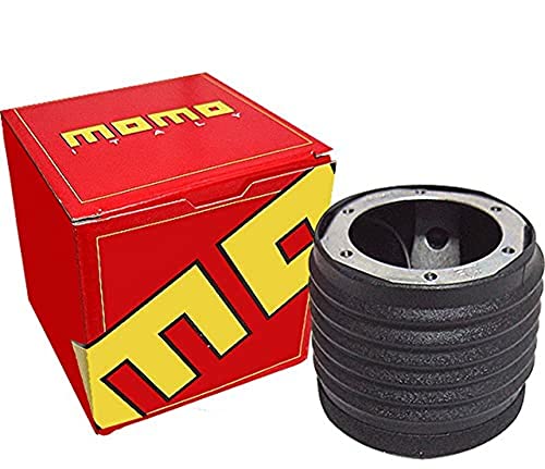 Red box with "MOMO" logo and a black steering wheel hub adapter, featuring a ribbed design and metal mounting plate, designed for 1977-1984 BMW models.
