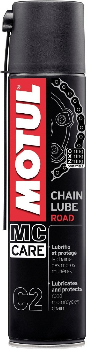 Black spray can with a red and white label, featuring "MOTUL MC Care C2 Chain Lube Road" text, and a graphic of a motorcycle chain, designed for lubricating and protecting motorcycle chains.
