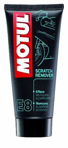 Black tube of Motul E8 Scratch Remover featuring a bright red "MOTUL" logo and green text, designed to remove superficial scratches from surfaces.
