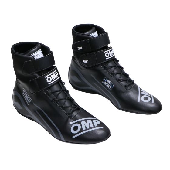 Black rainproof kart shoes with a sleek design, featuring OMP branding, a lace-up front, and Velcro strap for secure fit, available in UK size 3.5 / EUR 36.