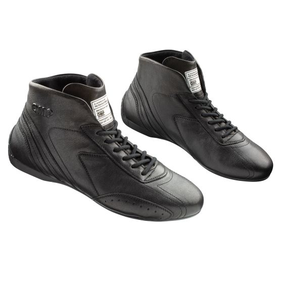 Black leather OMP Carrera race boots, UK size 9.5 / EUR 44, featuring a high-top design, lace-up closure, and textured side panels for grip and support.
