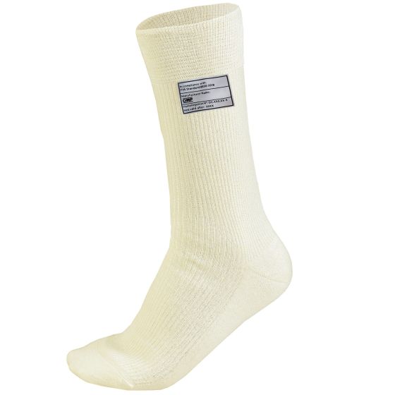 White calf-length socks made of a textured material, featuring a label with care instructions, designed for a snug fit in size XS.