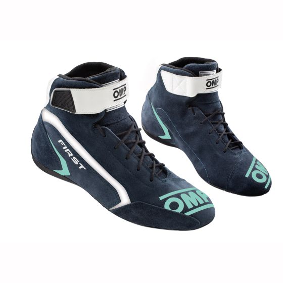 Navy blue and light blue OMP First Race Boots, featuring a high-top design, white ankle strap, and distinctive branding, available in UK size 5.5 / EUR 39.