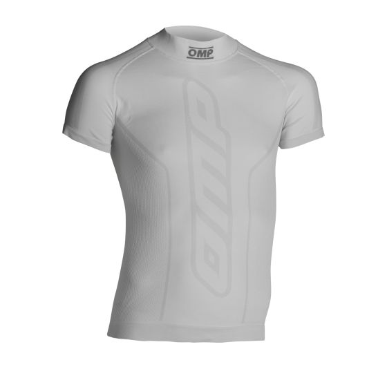 White short sleeve top by OMP, featuring a fitted design, textured fabric, and prominent OMP logo on the front, available in size XL/XXL.