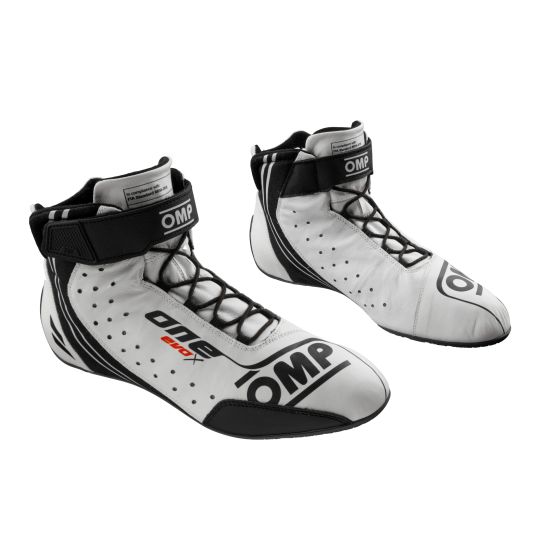 White OMP One Evo X race boots featuring a sleek design, lace-up front, ankle support, perforated detailing for breathability, and size UK 5 / EUR 38.