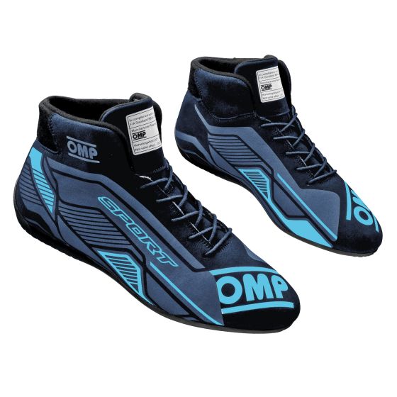 Black and cyan OMP Sport Race Boots featuring a sleek design, high-top style, and prominent branding, available in UK size 12 / EUR 47.