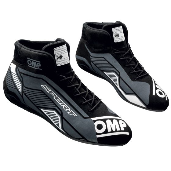 Black and white OMP Sport Race Boots in UK size 11/Eur 46, featuring a sleek design with a high-top silhouette, reinforced toe, and textured grip for racing performance.