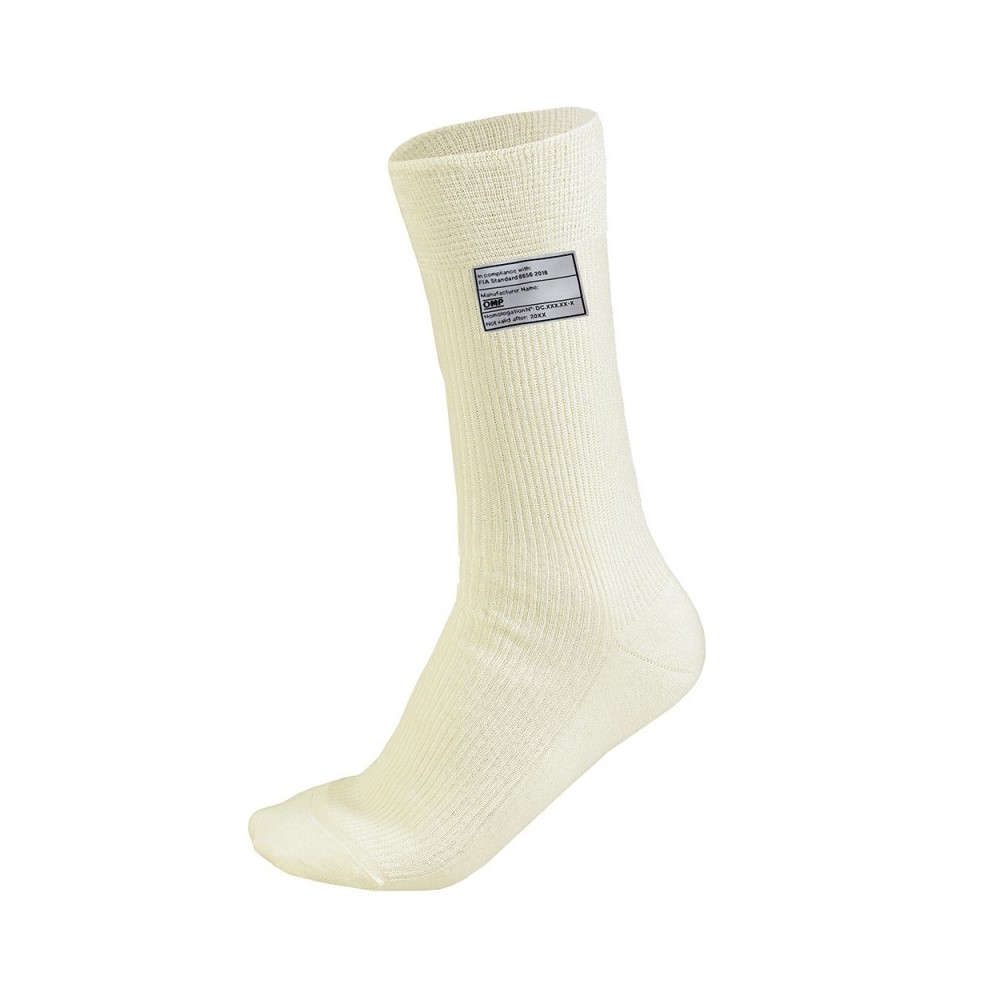 Cream-colored Nomex socks with a ribbed texture, featuring a label on the side, designed for thermal protection in motorsport environments.