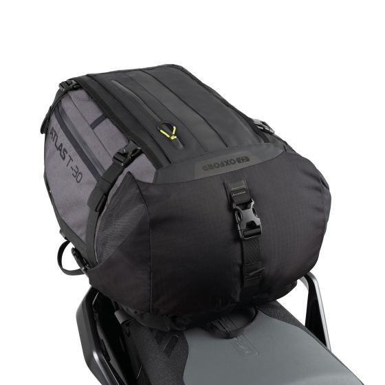 Waterproof Oxford Atlas T-30 luggage bag in black and dark grey, featuring a sturdy design, adjustable straps, and a capacity of 30 liters, ideal for motorcycle use.