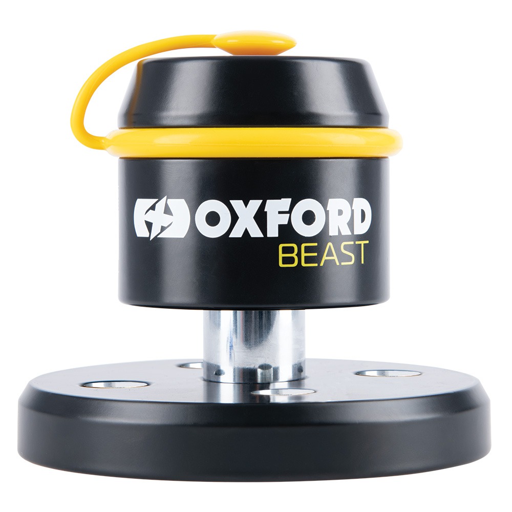 Black and yellow OXFORD LK115 Immobilizer with a cylindrical top, featuring a yellow securing strap and a sturdy circular base for enhanced motorcycle security.
